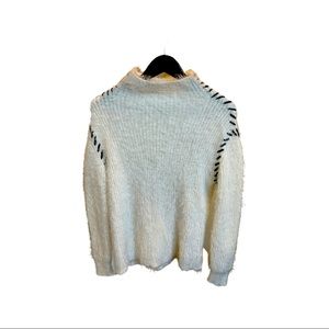 1. State: Cream and black, texturized sweater(X-Small)
